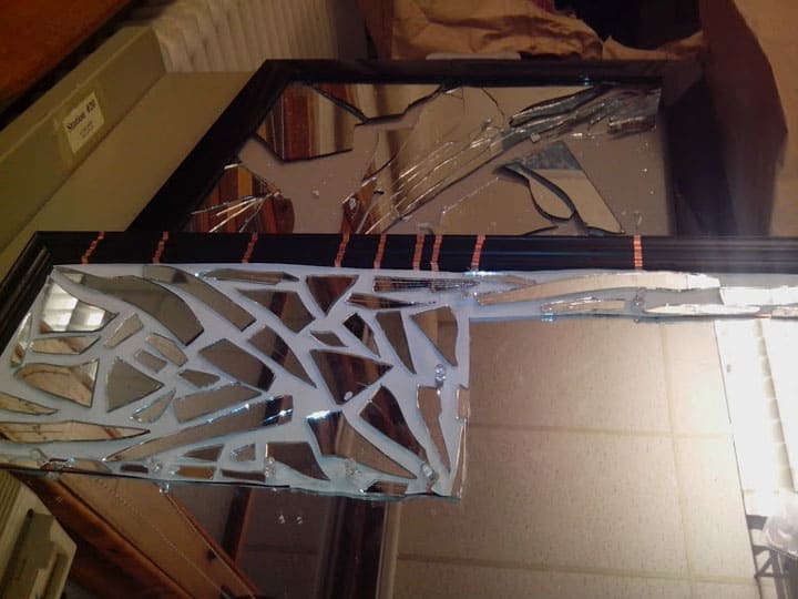 how to break a mirror